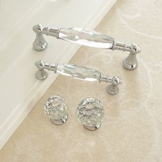 two crystal knobs and one glass door handle