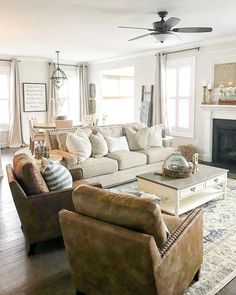 a living room filled with furniture and a fire place