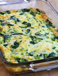 a casserole dish with spinach and cheese