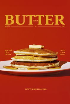 a stack of pancakes sitting on top of a white plate next to a red wall