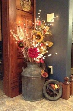 a vase filled with flowers sitting on top of a floor