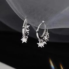 𝔇𝔢𝔱𝔞𝔦𝔩𝔰: Style: Grunge, Harajuku, Alt Material: Zinc Alloy & Metal Quantity: 1 pair Highlights: This is a pair of grunge-style ear hoop earrings featuring star-shaped pendants. They are cute and special, perfectly matching your grunge or dark wardrobe. The design is very unique and will be the ideal addition to your collection. Enjoy free shipping with a purchase of over 80$ Trendy Silver Star Charm Earrings, Silver Star-shaped Hoop Earrings, Silver Star Hoop Earrings For Parties, Silver Hoop Earrings With Star Charm For Party, Trendy Silver Earrings With Star Charm, Silver Star-shaped Hoop Earrings For Party, Silver Star Shaped Hoop Earrings For Party, Silver Dangle Hoop Earrings With Star Charm, Trendy Hoop Earrings With Star Charm For Party