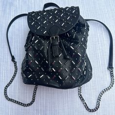 New Charming Charlies Black & Silver Studded Chained Backpack. Unused & Ready For You! Draw Closure And Single Snap One Inside Zipped Pocket Two Convenient Front Pockets Width Can Spread Out To 12” & Pull Into 9” Depth 10” Base 9” X 6” Chain Portion Of The Strap 15” Leather Portion Of Strap 14” No Silver Studs Missing & Excellent Condition Trendy Travel Backpack With Chain Strap, New Charmed, Walker Boots, Charming Charlie, Fit N Flare Dress, Rain And Snow Boots, Soul Food, Silver Studs, Laptop Bag