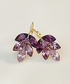 Gorgeous pair of leaf earrings featuring Swarovski 8x4mm marquise crystals in shades of purple and mauve.  So pretty!  Shown in the gold metal finish.  Earrings are 1 inch long as shown, 3/4 inch long in the post-back version.  Please select style from the drop down menu at checkout. Thanks for stopping by! Mauve Earrings, Fancy Soap, Blink Blink, Purple Mauve, Earrings Bridesmaid, Purple Love, Purple Earrings, Swarovski Crystal Earrings, Wedding Jewelry Earrings