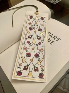 a bookmark with an embroidered design on it