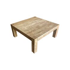 a wooden table sitting on top of a white floor