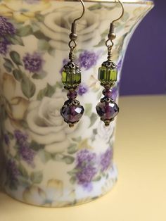 Love the deep rich Amethyst pairing with the Olivine Cathedral. Looks back in the day classic. The purple and green compliment and pair so well together.  Comfortable and lightweight. Available in ear wire or lever back which are both hypoallergenic, lead free and nickel free.  Gift wrapping is included. Please stop by my Etsy store to see over 700 listings of personally designed and handmade jewelry items and hair accessories. Earrings Handmade Dangle, Custom Earrings, Handcrafted Earrings, Jewelry Inspo, Glass Earrings, Czech Glass Beads, Antique Style, Vintage Boho, Ear Wires