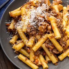 pasta with meat and parmesan cheese on a plate