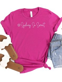 Look your sweetest in the official Sydney So Sweet tee! Made of a blissfully soft cotton blend, this high-quality short sleeve shirt comes in six delicious colors and seven sizes, so you're sure to find your perfect fit. Plus, show off your love of this sweet company! INCLUDES: T-Shirt UNISEX SIZES: XS, S, M, L, XL, XXL, XXXL FIT: This item is true to size. FABRIC & CARE: Machine Washable 100% combed and ring spun cotton (fiber content may vary for different colors) Bella + Canvas Brand This cla Sweet Summer T-shirt With Crew Neck, Sweet Short Sleeve Cotton T-shirt, Sweet Style Short Sleeve Cotton T-shirt, Sweet Cotton T-shirt With Short Sleeves, Sweet Summer T-shirt With Letter Print, Summer Sweet T-shirt With Letter Print, Sweet Tee, Columbia Blue, So Sweet