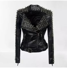 Introducing our Women Alligator Textured Leather Studded and Spiked Rock Fashion Jacket, the perfect statement piece for fashion-forward women who dare to stand out. Crafted with utmost precision and attention to detail, this jacket is designed to elevate your style and make a bold fashion statement. Made from high-quality leather, this jacket boasts a unique alligator textured finish that adds a touch of edginess and sophistication to your ensemble. The textured leather not only exudes luxury but also ensures durability, making this jacket a long-lasting investment for your wardrobe. Embellished with studs and spikes, this jacket exudes a rebellious and rock-inspired vibe. The carefully placed studs and spikes add an extra layer of attitude and make this jacket a true head-turner. Whether Streetwear Motorcycle, Stile Punk Rock, Print Outerwear, Short Leather Jacket, Mode Punk, Pu Jacket, Moda Punk, Pu Leather Jacket, Slim Fit Jackets