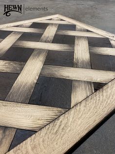 a close up of a wooden table with an interesting pattern on the top and bottom