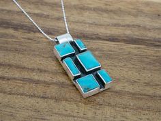 Modern Turquoise Sterling Silver Jewelry, Artisan Faceted Sterling Silver Jewelry, Artisan Sterling Silver Faceted Jewelry, Handmade Geometric Sterling Silver Jewelry, Handmade Sterling Silver Geometric Jewelry, Nickel Free Turquoise Rectangular Jewelry, Gift Turquoise Necklace With Sterling Silver Inlay, Sterling Silver Turquoise Faceted Necklace, Rectangular Sterling Silver Jewelry With Inlay