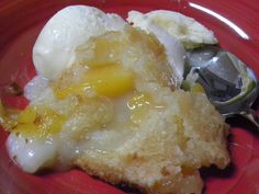 a red plate topped with an egg and some kind of pastry on top of it