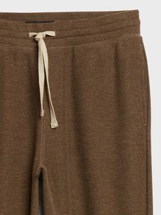 Mid-rise and relaxed, this cozy jogger uses midweight fabric that has been brushed inside and out for extra softness, much like a thermal knit.  SUSTAINABILITY: Made with a blend of certified, organically grown cotton that's easier on the earth and r Cozy Ribbed Cotton Bottoms, Cozy Everyday Joggers, Ribbed Cotton Loungewear Bottoms, Ribbed Cotton Bottoms For Loungewear, Brown Relaxed Fit Sweatpants For Winter, Winter Brown Relaxed Fit Sweatpants, Solid Soft-washed Sweats For Loungewear, Soft-washed Solid Color Sweats For Loungewear, Solid Color Soft-washed Sweats For Loungewear