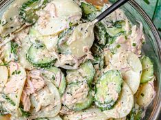 a bowl filled with cucumber and potato salad