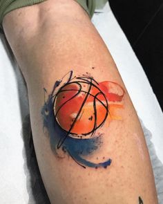 a person with a basketball tattoo on their arm and leg, showing the ball painted in different colors