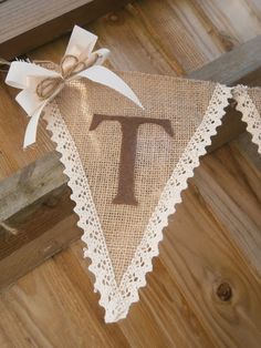 a burlap banner with the letter t on it