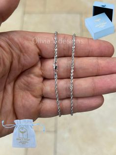 Genuine 10k White Gold Handmade 2mm Rope Chain Diamond-cut. Stunning necklace to add to your jewelry collection. Makes an amazing gift  for anyone. Add your favorite charms or wear it alone. These are all Genuine Solid 10K Gold, Not plated or filled Semi Hollow Chain Lobster Claw For Added Security  Average Weights: *16"   1.50 Grams Arrives in a Velvet Gift Pouch and includes FREE SHIPPING to the USA To see more chains and other handcrafted jewelry collections, please visit my storefront here : https://www.etsy.com/shop/OliviaVdesigns About OliviaVDesigns: Thanks for taking a look at Olivia V. Designs  Been doing jewelry all my life. This is my specialty :) I'm a jewelry designer working in my hometown Brooklyn,  where I was born and raised. I have a cute workshop in my house where I crea Designer Working, Necklace Everyday, Chain Diamond, Gift Pouch, Gold Sparkle, Stunning Necklace, Jewelry Designer, Rope Chain, 10k Gold