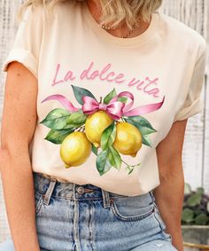 Unleash your zest for style with our refreshing Italy Lemons Shirt. Inspired by the vibrant Amalfi Coast lemons, this travel t-shirt brings a burst of citrus charm to your wardrobe. Made from soft cotton, it offers a comfortable and breathable fit. The botanical lemon print adds a touch of whimsy, perfect for gardeners and nature enthusiasts. Embrace your unique sense of fashion with this indie-inspired piece that stands out from the crowd. Whether you're looking for a cute fruit shirt or simply Lemon Shirt, Italy Shirt, Fruit Shirt, Italian Quotes, Botanical Shirt, Gardening Shirts, Lemon Print, Garden Parties, Aesthetic Clothing