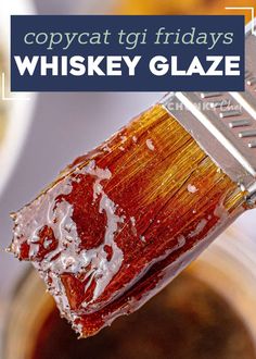 a close up of a paint brush with the words copycat tgi friday's whiskey glaze