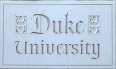 the duke university sign is shown in white