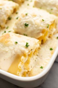 a casserole dish filled with cheese and meat