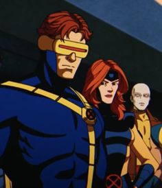 the x - men are standing next to each other