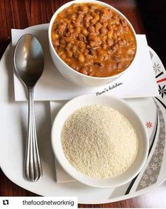 a white plate topped with two bowls filled with beans