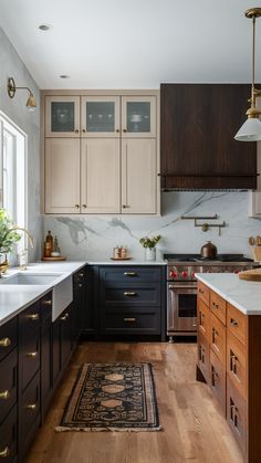 a kitchen with wooden cabinets and marble counter tops, along with a rug on the floor