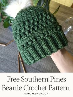 a hand holding a green knitted beanie with text overlay that says free southern pines beanie crochet pattern