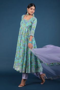 Aqua green anarkali with spring print and metallic panels. Paired with pant and printed hem dupatta.
Component: 3
Pattern: Printed
Type Of Work: Spring
Neckline: Square
Sleeve Type: Three Quarter
Fabric: Anarkali and Pant: Cotton, Dupatta: Organza
Color: Green
Other Details: 
Printed hem dupatta
Back tassel tie-up
Occasion: Puja - Aza Fashions Designer Pista Green Anarkali Set With Printed Motifs, Pista Green Anarkali Set With Printed Motifs, Green Floor-length Anarkali Set With Printed Motifs, Pista Green Anarkali Set For Navratri With Printed Motifs, Navratri Pista Green Anarkali Set With Printed Motifs, Festive Green Anarkali Set With Printed Motifs, Green Chanderi Anarkali Set With Printed Motifs, Green Anarkali Salwar Kameez With Printed Motifs, Green Cotton Sharara With Sheer Dupatta