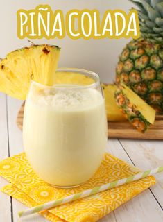 a pineapple smoothie in a glass on a yellow napkin