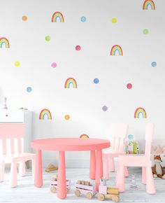 children's playroom with pastel furniture and rainbow wall stickers on the walls