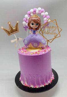 a purple cake with a princess on top and balloons around the edges that say happy birthday