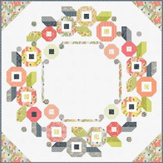 a circular quilt is shown with many different colors and shapes on it's border