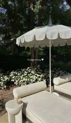 an umbrella sitting on top of a white couch