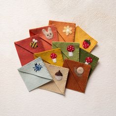 several envelopes with different designs on them