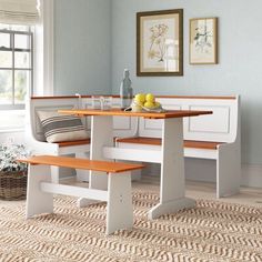 a kitchen table with two benches in front of it