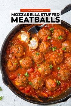 a skillet filled with meatballs covered in tomato sauce