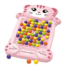 a pink toy with lots of colorful balls in the shape of a cat's face