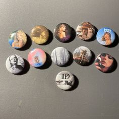 six different buttons with the faces of famous movie stars on them, all in various shapes and sizes