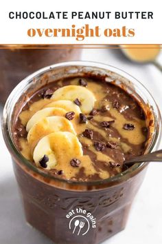 chocolate peanut butter overnight oats in a glass with bananas and chocolate chips on top