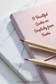 two pencils sitting on top of a pink book with the title 13 beautiful quotes on simplifying from books