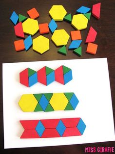 the paper is cut out to make geometric shapes and then put them on top of each other