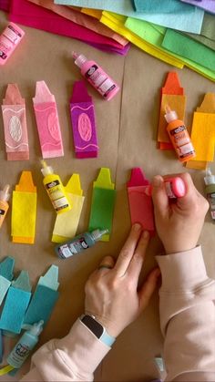 a person is making crafts with felt and glue