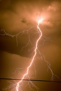 a lightning bolt is seen in the sky