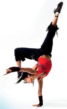 a man doing a handstand on his skateboard in front of a white background