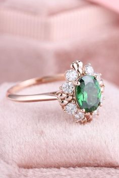 Emerald gemstone is never out of fashion. Shop this vintage emerald ring, perfect gift for your anniversary #emeraldring #engagementring #rings #stylishring #vintagering Oval Green Cluster Ring For Wedding, Wedding Ring With May Birthstone In Oval Cabochon, Oval Cabochon Wedding Ring With May Birthstone, Oval Halo Ring For May Birthstone Gifts, Heirloom Green Oval Halo Ring, Oval Emerald Cluster Ring Gift, Oval Emerald Cluster Ring As Gift, Oval Emerald Halo Ring For Gift, Oval Emerald Halo Ring As A Gift