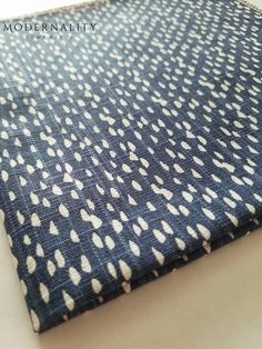 the fabric is blue and white with dots on it