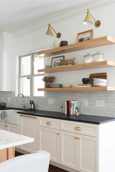 the kitchen is clean and ready for us to use it's shelves are open